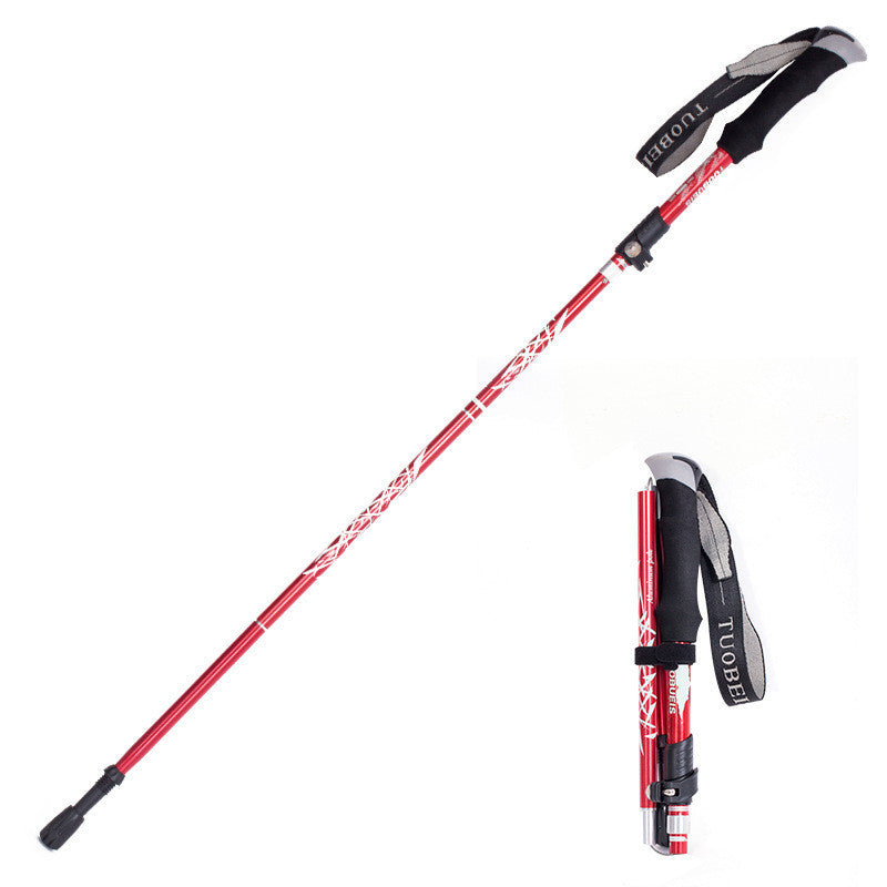 Red and black hiking poles with adjustable shafts on a white background