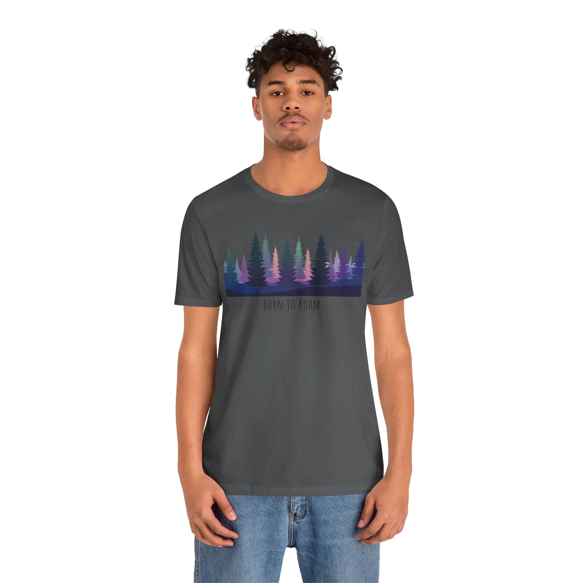 Person wearing a dark gray t-shirt with a colorful forest design on a white background