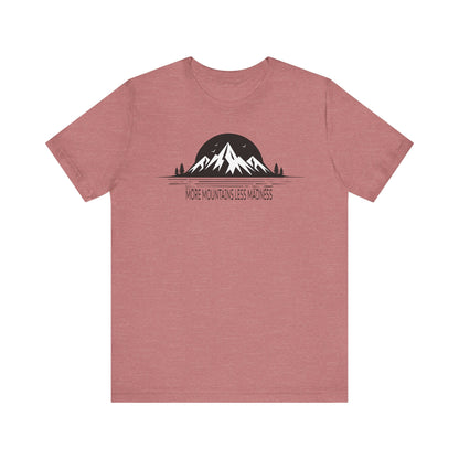 Mauve t-shirt with mountain graphic and text on a white background