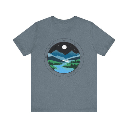 Gray t-shirt with a circular design of a mountain landscape on a white background