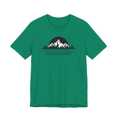 Green t-shirt with mountain graphic and text on a white background