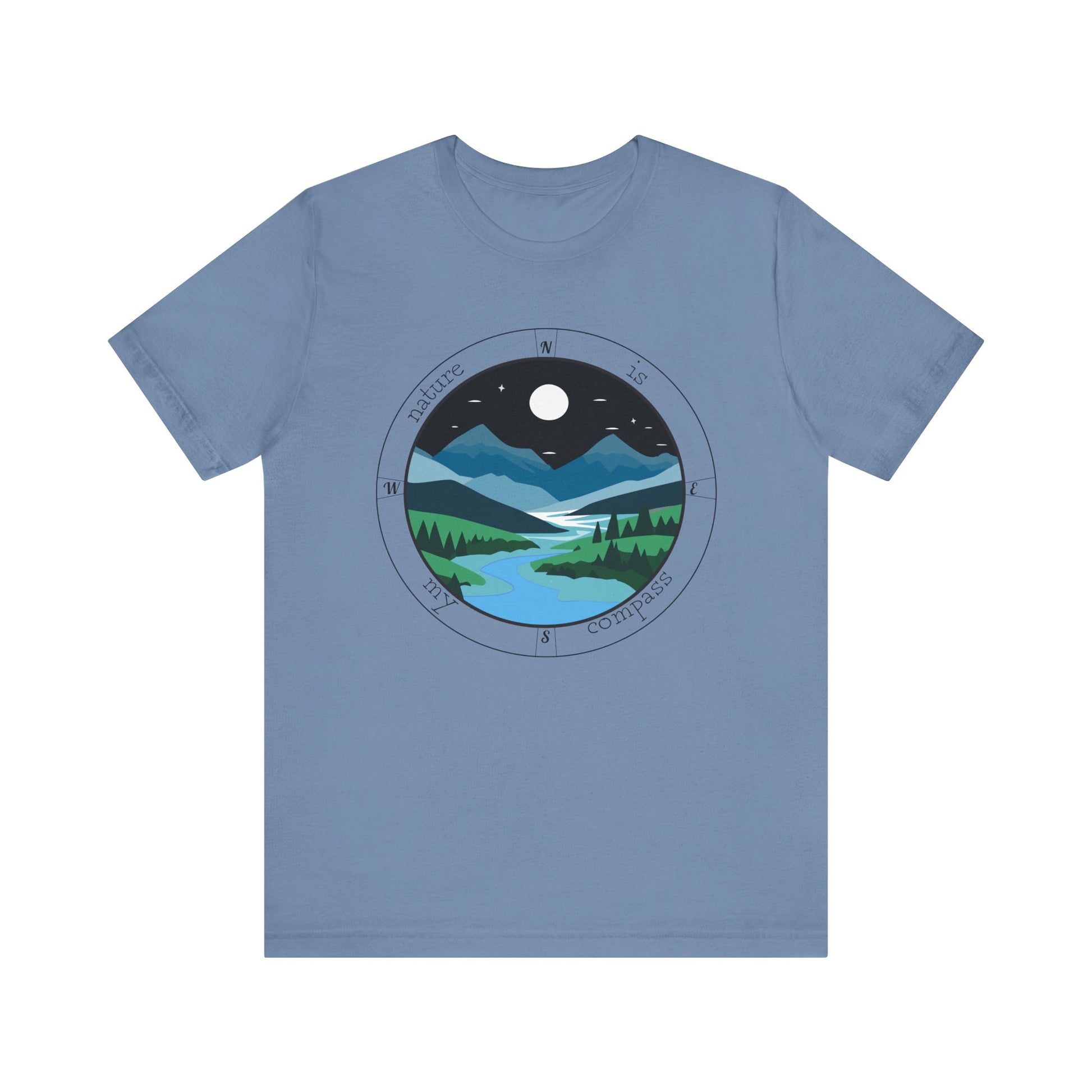 Blue t-shirt with a circular design of a night scene with mountains and a moon on a white background
