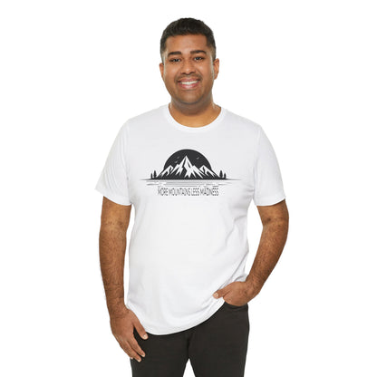 Man wearing a white t-shirt with a mountain graphic and text on a white background