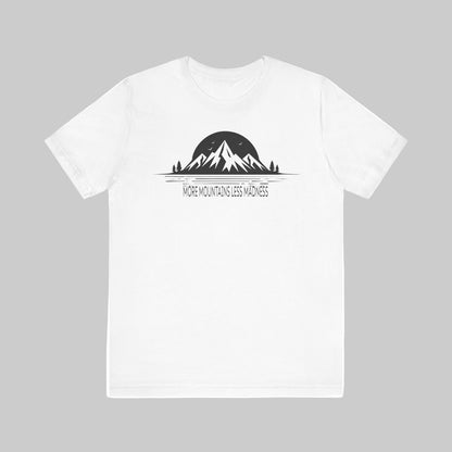 White t-shirt with mountain graphic and text 'More Mountains Less Madness' on a white background